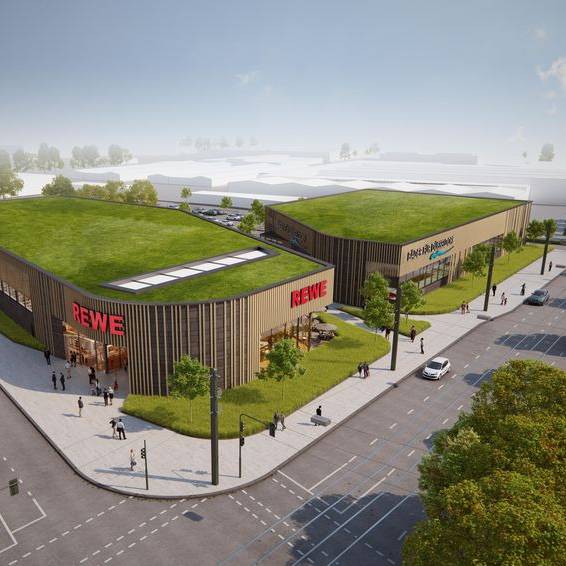 So sollen der neue REWE und das neue Hallenbad an der Ulmenstraße einmal aussehen. Für das Bad rechnet Bezirksbürgermeisterin Schentek mit einer Eröffnung frühestens Ende 2028.