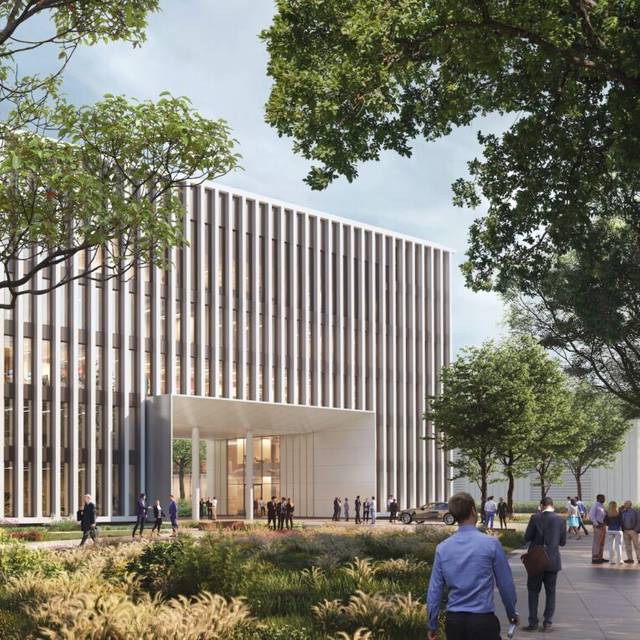 Eine Visualisierung vom neuen Messe Düsseldorf Cube. Ein modernes Verwaltungsgebäude mit vielen Fenstern und Bäumen.