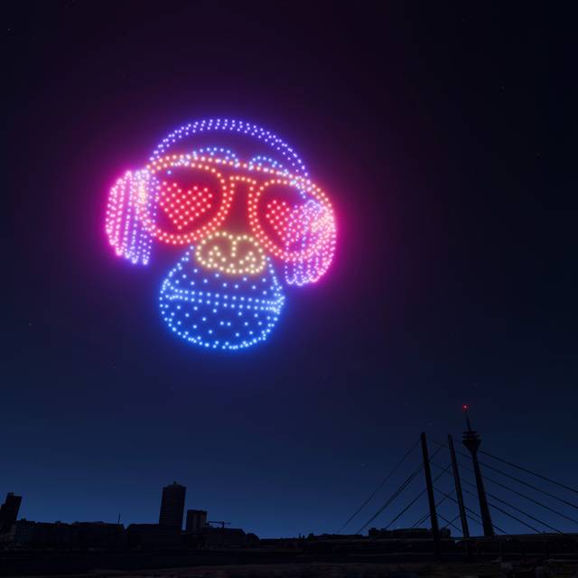 Eine Visualiesierung der Drohnenshow zur Rheinkirmes. Drohnen malen einen Affen mit Kopfhörern in den Himmel.