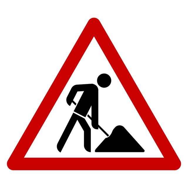 Ein Verkehrsschild weist auf eine Baustelle hin.