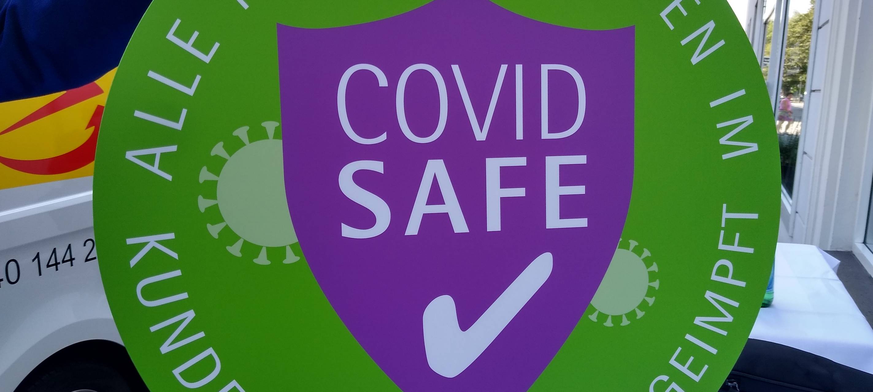 Impfkampagne: Aufkleber für Unternehmen in Düsseldorf