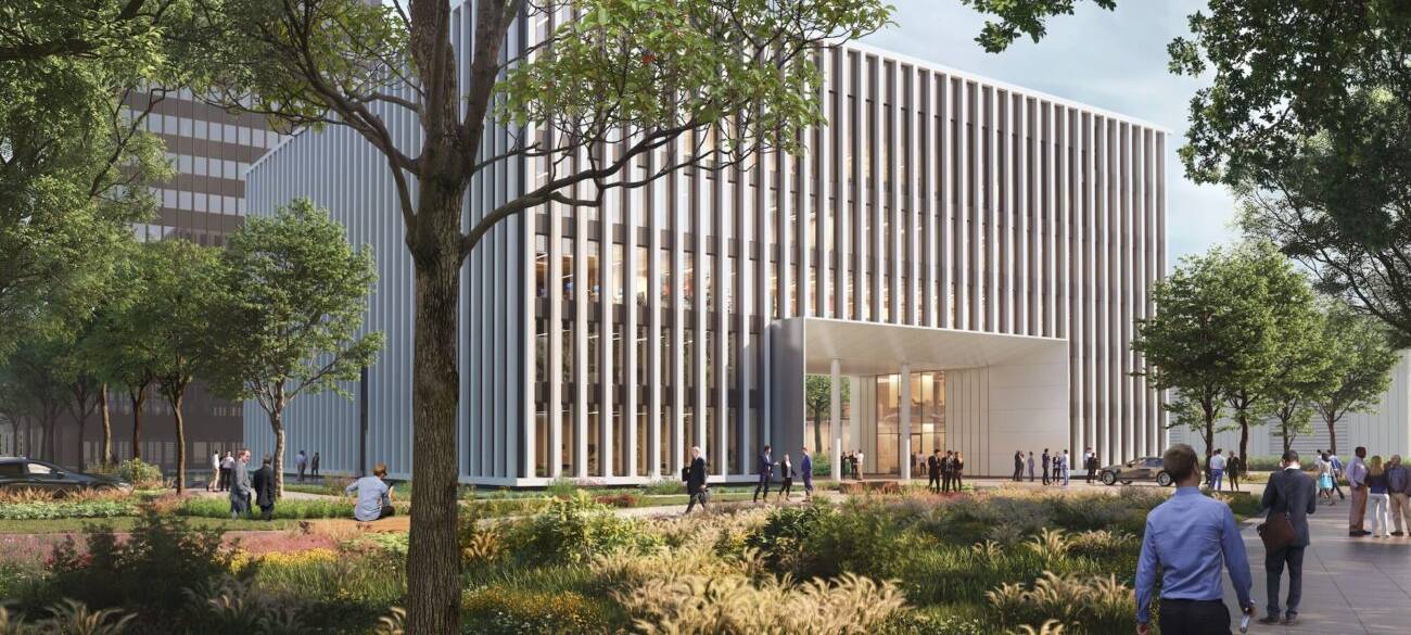 Eine Visualisierung vom neuen Messe Düsseldorf Cube. Ein modernes Verwaltungsgebäude mit vielen Fenstern und Bäumen.