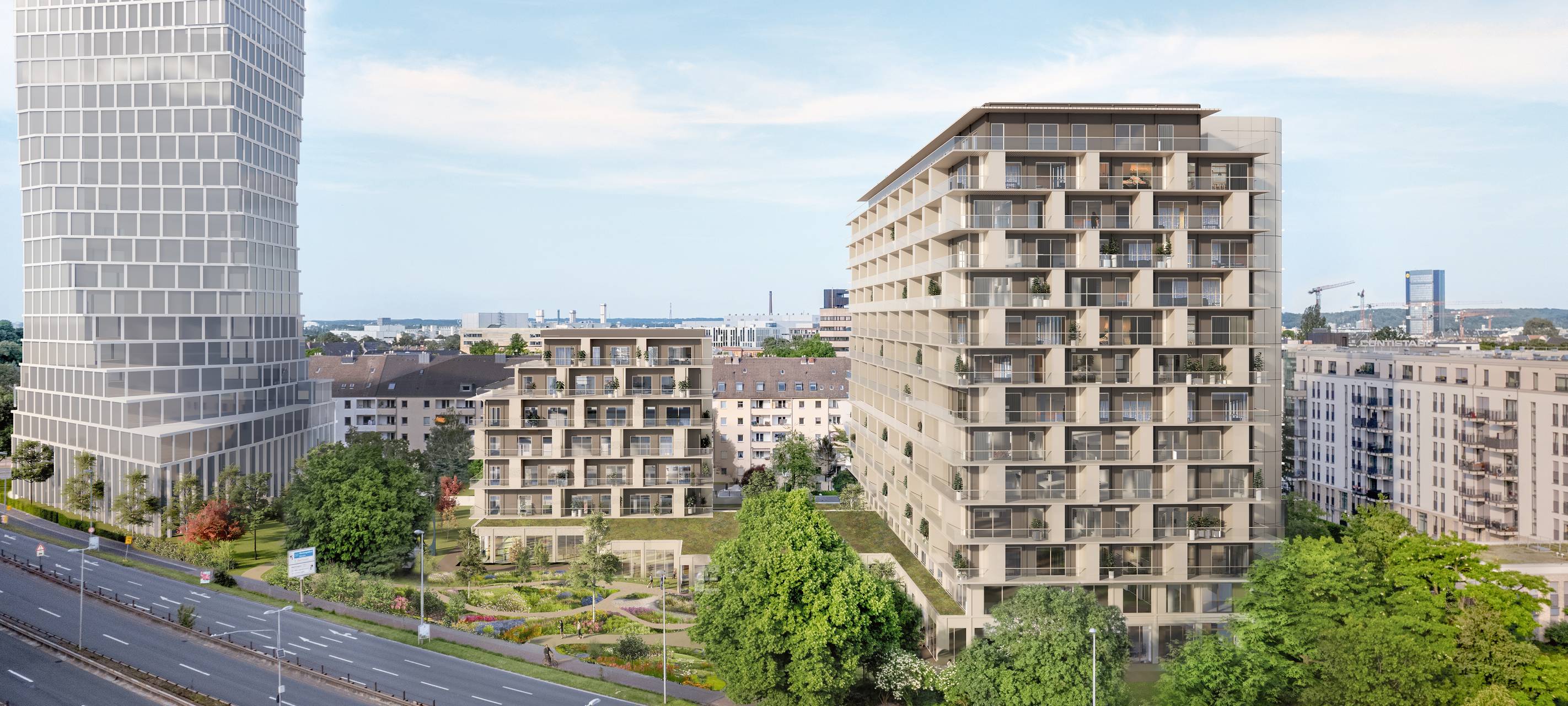 Eine Visualisierung eines Wohnquartiers am Kennedydamm. Mehrere Wohnhäuser stehen am Kennedydamm. Rundherum gibt es einige Grünflächen.