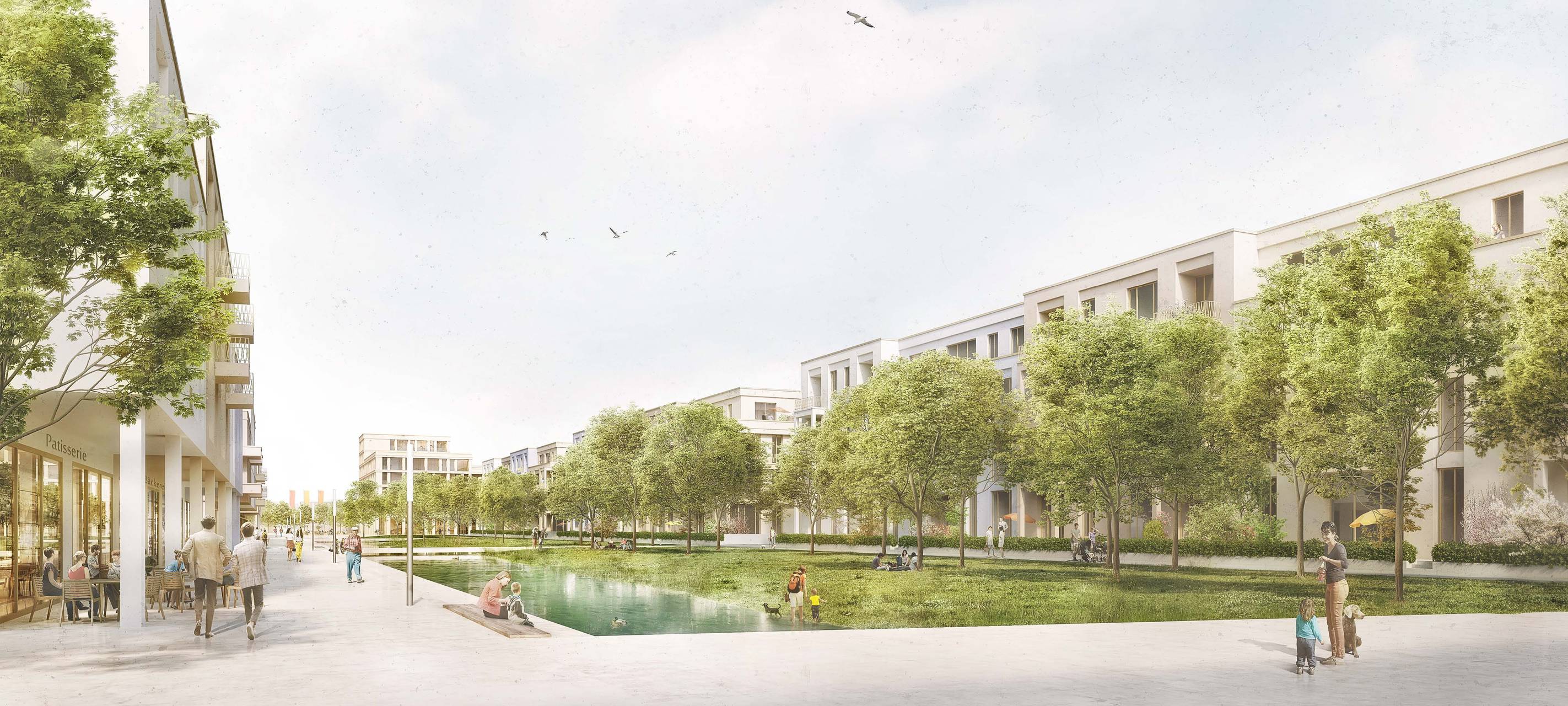 Ein weitläufiger, begrünter Innenhof mit Wasserfläche, eingerahmt von Mehrfamilienhäusern.