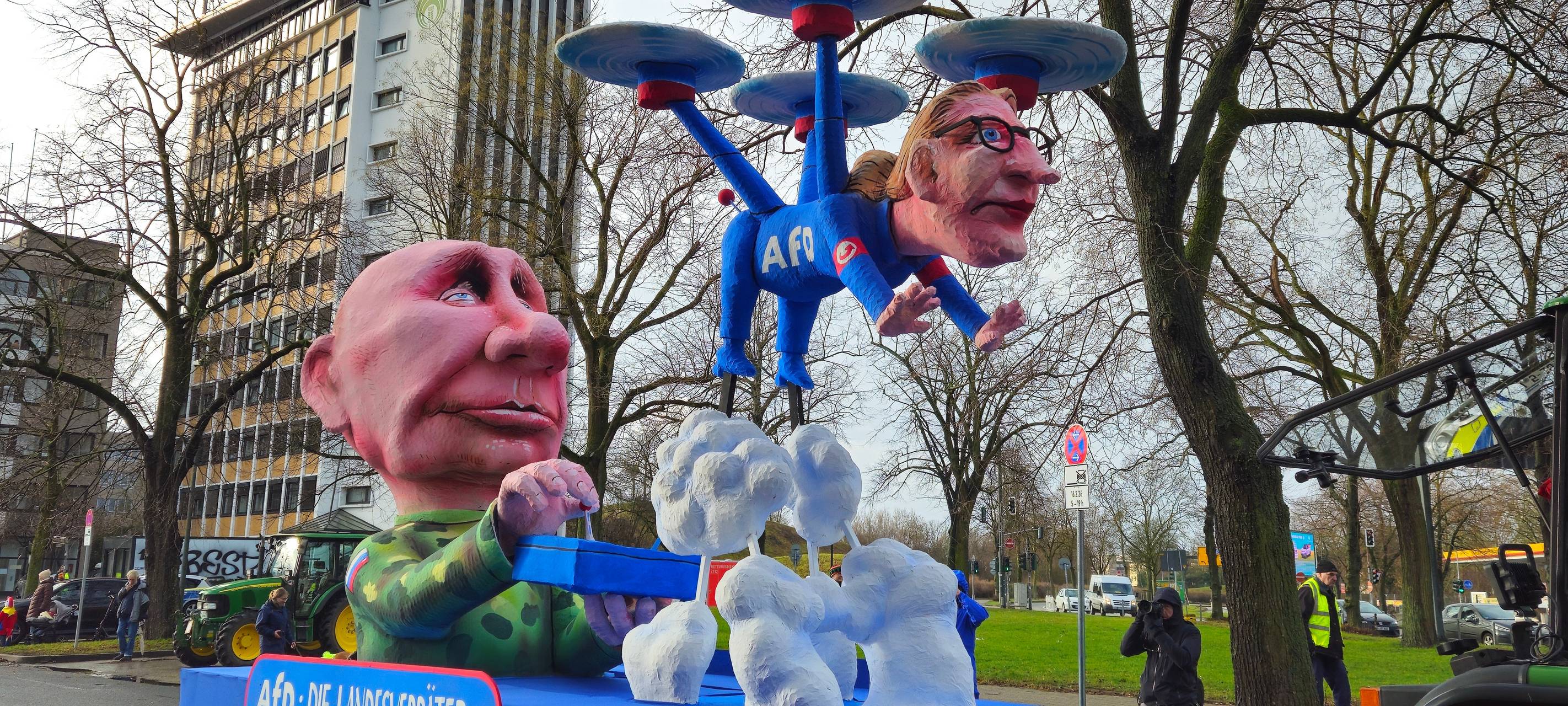 Putin steuert mit einer Fernbedinung die AFDin Form einer Drohne