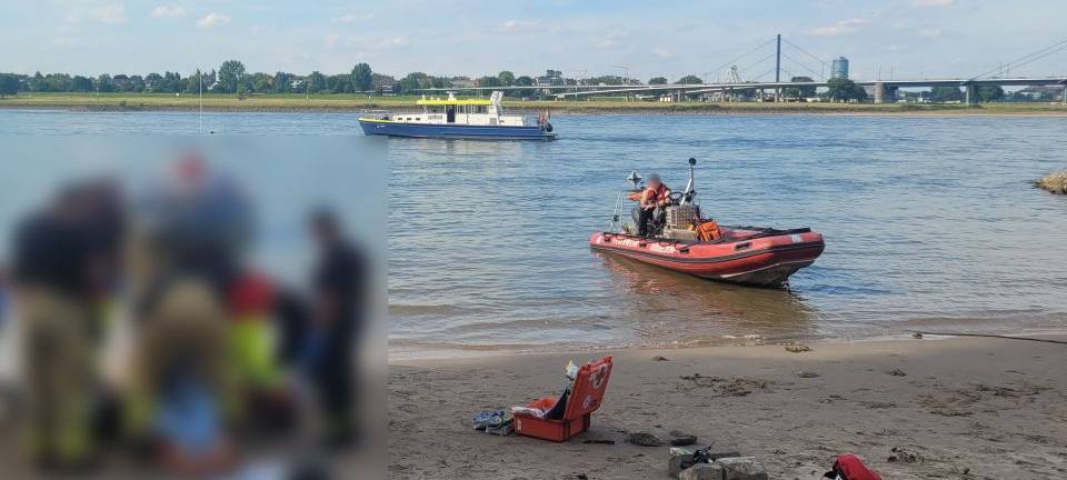 Rettungsszene am Rheinufer - im Hintergrund der Rhein und Rettungsboote, im Fordergrund verpixelt die Reanimation eines Mannes, der im Rhein gebadet hatte.